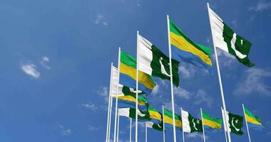 Pakistan and Gabon Flags Waving Together in the Sky, Seamless Loop in Wind, Space on Left Side for Design or Information, 3D Rendering video