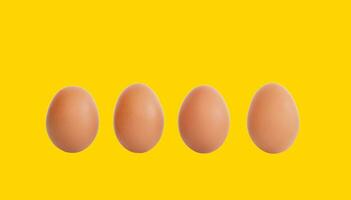 fresh brown chicken eggs isolated on yellow background photo