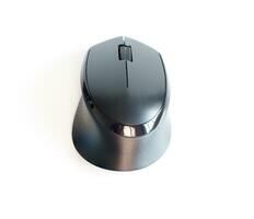 Top view of a black wireless mouse on white background. photo