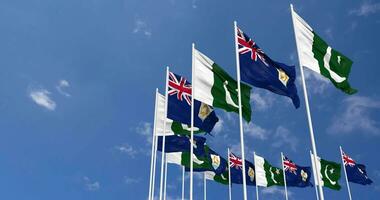 Pakistan and Anguilla Flags Waving Together in the Sky, Seamless Loop in Wind, Space on Left Side for Design or Information, 3D Rendering video