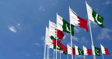 Pakistan and Bahrain Flags Waving Together in the Sky, Seamless Loop in Wind, Space on Left Side for Design or Information, 3D Rendering video