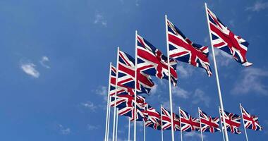 United Kingdom Flags Waving in the Sky, Seamless Loop in Wind, Space on Left Side for Design or Information, 3D Rendering video