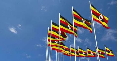 Uganda Flags Waving in the Sky, Seamless Loop in Wind, Space on Left Side for Design or Information, 3D Rendering video