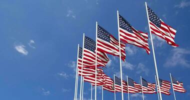 United States Flags Waving in the Sky, Seamless Loop in Wind, Space on Left Side for Design or Information, 3D Rendering video