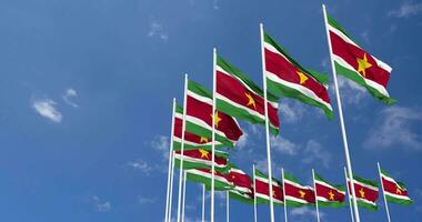 Suriname Flags Waving in the Sky, Seamless Loop in Wind, Space on Left Side for Design or Information, 3D Rendering video