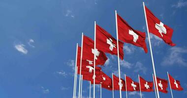 Switzerland Flags Waving in the Sky, Seamless Loop in Wind, Space on Left Side for Design or Information, 3D Rendering video