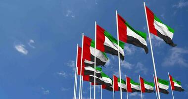 United Arab Emirates Flags Waving in the Sky, Seamless Loop in Wind, Space on Left Side for Design or Information, 3D Rendering video