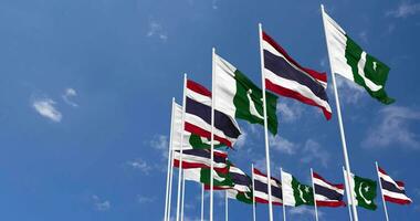 Pakistan and Thailand Flags Waving Together in the Sky, Seamless Loop in Wind, Space on Left Side for Design or Information, 3D Rendering video