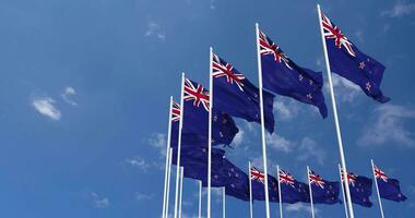 New Zealand Flags Waving in the Sky, Seamless Loop in Wind, Space on Left Side for Design or Information, 3D Rendering video