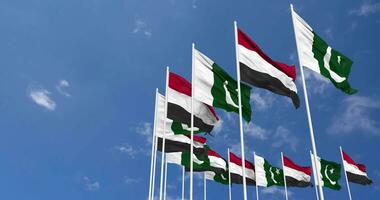 Pakistan and Yemen Flags Waving Together in the Sky, Seamless Loop in Wind, Space on Left Side for Design or Information, 3D Rendering video