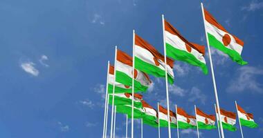 Niger Flags Waving in the Sky, Seamless Loop in Wind, Space on Left Side for Design or Information, 3D Rendering video