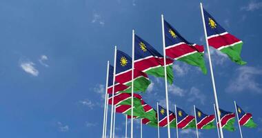 Namibia Flags Waving in the Sky, Seamless Loop in Wind, Space on Left Side for Design or Information, 3D Rendering video