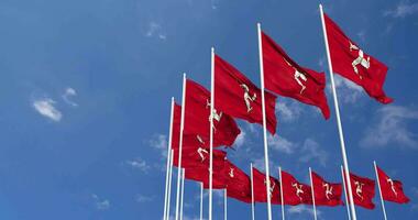 Isle of Man Flags Waving in the Sky, Seamless Loop in Wind, Space on Left Side for Design or Information, 3D Rendering video