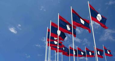 Laos Flags Waving in the Sky, Seamless Loop in Wind, Space on Left Side for Design or Information, 3D Rendering video