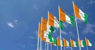 Ivory Coast Flags Waving in the Sky, Seamless Loop in Wind, Space on Left Side for Design or Information, 3D Rendering video