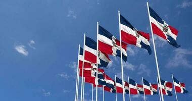 Dominican Republic Flags Waving in the Sky, Seamless Loop in Wind, Space on Left Side for Design or Information, 3D Rendering video