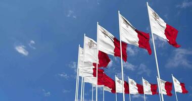 Malta Flags Waving in the Sky, Seamless Loop in Wind, Space on Left Side for Design or Information, 3D Rendering video