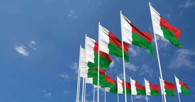 Madagascar Flags Waving in the Sky, Seamless Loop in Wind, Space on Left Side for Design or Information, 3D Rendering video