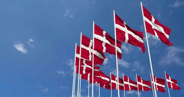 Denmark Flags Waving in the Sky, Seamless Loop in Wind, Space on Left Side for Design or Information, 3D Rendering video