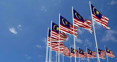 Malaysia Flags Waving in the Sky, Seamless Loop in Wind, Space on Left Side for Design or Information, 3D Rendering video