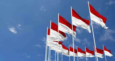 Indonesia Flags Waving in the Sky, Seamless Loop in Wind, Space on Left Side for Design or Information, 3D Rendering video