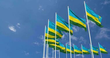 Rwanda Flags Waving in the Sky, Seamless Loop in Wind, Space on Left Side for Design or Information, 3D Rendering video