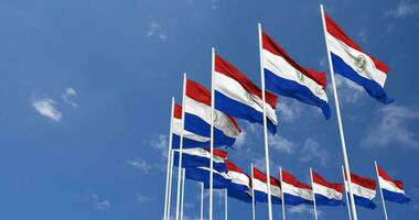 Paraguay Flags Waving in the Sky, Seamless Loop in Wind, Space on Left Side for Design or Information, 3D Rendering video