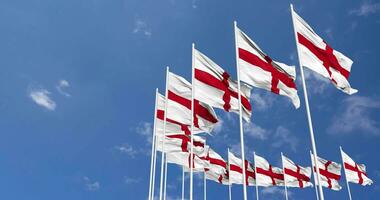 England Flags Waving in the Sky, Seamless Loop in Wind, Space on Left Side for Design or Information, 3D Rendering video