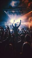 AI generated live band playing on stage in a dimly lit nightclub, with a sea of enthusiastic fans jumping photo