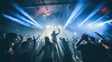 AI generated live band playing on stage in a dimly lit nightclub, with a sea of enthusiastic fans jumping photo