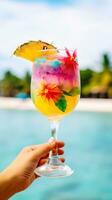 AI generated hand holding a colorful cocktail glass with a tropical beach background photo