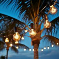 AI generated string of light bulb garlands hanging between two palm trees on a beach photo