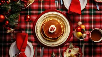 AI generated table set with Christmas-themed crockery, including pancakes, eggs, bacon, and hot cocoa. photo