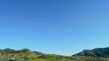 Wind turbines energy renewable at field in the mountains video