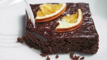 cutting brownie with a fork on plate video