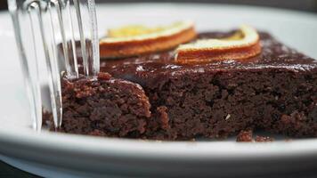 slice of brownie on plate on table . video