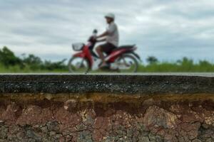 The layer of asphalt road with soil and rock. photo