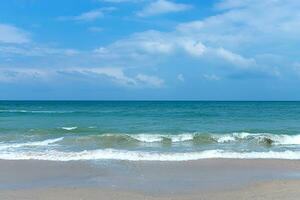 Green water in the sea on the beach. photo