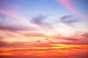 Beautiful of luxury soft gradient orange gold clouds and sunlight on the blue sky perfect for the background, take in everning,Twilight photo