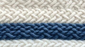 AI generated Macro photography of the texture of a knitted pattern in close-up, white and blue colors photo