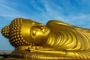 Close up of the golden Buddha statue. photo