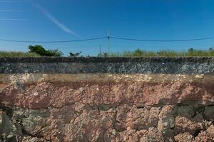 Soil and rock layers of the road photo