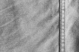 Texture and seam of denim fabric photo