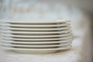 Stack of white plates side view photo
