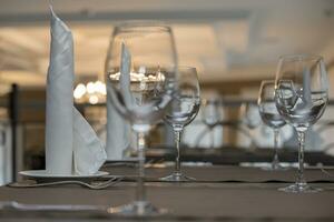 Glass goblets on the restaurant table. photo