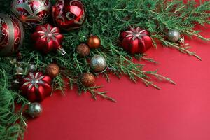Red winter background with christmas decorations and copy space photo