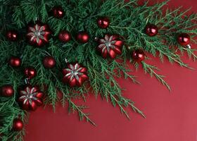 Red winter background with christmas decorations and copy space photo