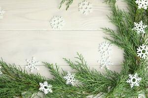 white wooden winter background with christmas decorations and copy space photo