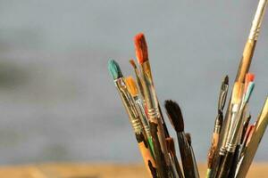 a close up of a bunch of paint brushes photo