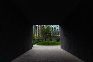 Abstract fragment of modern architecture, gray walls, glass and concrete. photo